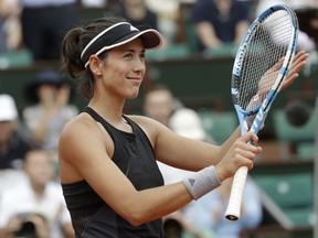 Spain's Garbine Muguruza celebrates winning her third round match of the French Open tennis tournament against Australia's Samantha Stosur in two sets 6-0, 6-2, at the Roland Garros stadium in Paris, France, Saturday, June 2, 2018.