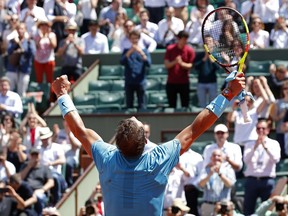 Spain's Rafael Nadal celebrates winning his quarterfinal match of the French Open tennis tournament against Argentina's Diego Schwartzman in four sets 4-6, 6-3, 6-2, 6-2, at the Roland Garros stadium in Paris, France, Thursday, June 7, 2018.