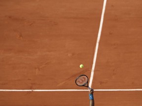 Argentina's Juan Martin del Potro serves against France's Julien Benneteau during their second round match of the French Open tennis tournament at the Roland Garros stadium in Paris, France, Thursday, May 31, 2018.