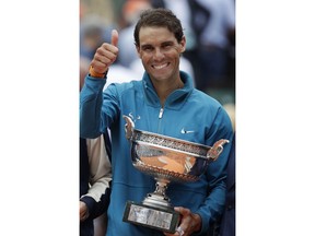 Spain's Rafael Nadal celebrates winning the men's final match of the French Open tennis tournament against Austria's Dominic Thiem in three sets 6-4, 6-3, 6-2, at the Roland Garros stadium in Paris, France, Sunday, June 10, 2018.