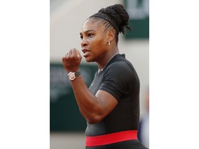 Serena Williams of the U.S. clenches her fist after scoring a point against Germany's Julia Georges during their third round match of the French Open tennis tournament at the Roland Garros stadium in Paris, France, Saturday, June 2, 2018.