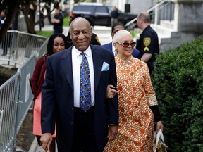 In this April 24, 2018 file photo, Bill Cosby, left, arrives with his wife, Camille, for his sexual assault trial at the Montgomery County Courthouse in Norristown, Pa.
