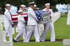 U.S. Navy personnel carry the casket of WWII U.S. Navy sailor Julius Pieper during a reburial service at the Normandy American Cemetery, Colleville-sur-Mer, France, Tuesday, June 19, 2018.