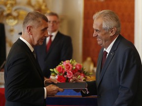 Czech Republic's President Milos Zeman, right, appoints Andrej Babis as Prime Minister at the Prague Castle in Prague, Czech Republic, Wednesday, June 6, 2018. The Czech Republic's president has again sworn in billionaire Andrej Babis as the prime minister in a move that could see the Communist Party taking a share of power for the first time since the 1989 anti-Communist Velvet Revolution.