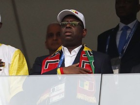 The President of Senegal Macky Sall listens to nation anthem prior the group H match between Poland and Senegal at the 2018 soccer World Cup in the Spartak Stadium in Moscow, Russia, Tuesday, June 19, 2018.