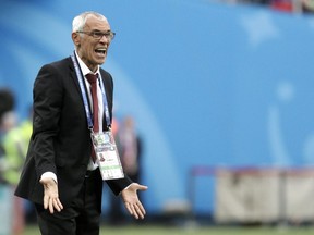 Egypt head coach Hector Cuper shouts during the group A match between Russia and Egypt at the 2018 soccer World Cup in the St. Petersburg stadium in St. Petersburg, Russia, Tuesday, June 19, 2018.