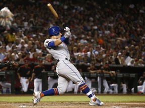 New York Mets' Michael Conforto connects for a three-run home run against the Arizona Diamondbacks during the second inning of a baseball game Saturday, June 16, 2018, in Phoenix.