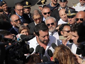 Italy's vice Prime Minister and Minister of the Interior, Matteo Salvini receives media attention as he arrives to visits to a so-called ''hot spot" in the Sicilian port of Pozzallo, where many of the rescue ships dock, disembarking migrants who need to be fingerprinted and otherwise identified as a first step in the process of seeking asylum, Sunday, June 3, 2018.