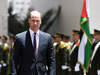 Prince William reviews honour guards before meeting with the Palestinian president Mahmud Abbas in the West Bank city of Ramallah on June 27, 2018.