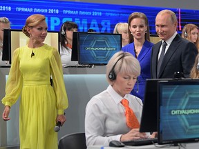 Russian President Vladimir Putin arrives to hold his annual televised phone-in with the nation in Moscow on June 7, 2018.