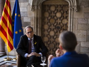 In this photo taken on Monday June 25, 2018, the President of the Catalonia regional government, Quim Torra, speaks during an interview with the Associated Press at the Palau de la Generalitat in Barcelona, Spain. Catalonia's new separatist chief plans to deliver one message to Spanish Prime Minister Pedro Sanchez in their highly-anticipated meeting next month: an official ballot over Catalan secession from Spain is the only solution to the country's worst political crisis in decades.