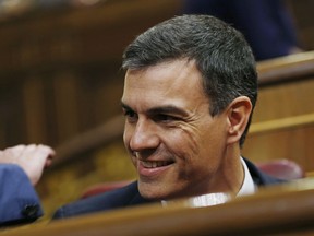 Spain's socialist opposition leader Pedro Sanchez smiles at the start of the second day of a motion of no confidence session at the Spanish parliament in Madrid, Friday, June 1, 2018. Spain's conservative government appears doomed to lose a no-confidence vote in parliament, with the center-left Socialist party poised to take power.