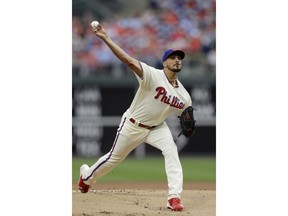 Philadelphia Phillies' Zach Eflin pitches during the first inning of a baseball game against the Milwaukee Brewers, Sunday, June 10, 2018, in Philadelphia.