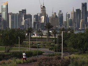 In this May 6, 2018 photo, a man jogs at Al Bidda park, in Doha, Qatar.