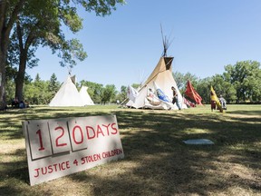 A sign indicates how long the Justice for Our Stolen Children camp has been set-up near the Saskatchewan Legislative Building in Regina on Wednesday, June 27, 2018.