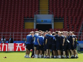 Players and staff huddle up at the start of Iceland's official training session on the eve of the group D match between Argentina and Iceland at the 2018 soccer World Cup in Spartak Stadium in Moscow, Russia, Friday, June 15, 2018.