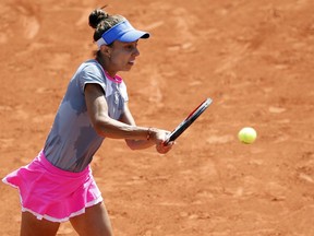 Romania's Mihaela Buzarnescu returns the ball to Madison Keys of the U.S. during their fourth round match of the French Open tennis tournament at the Roland Garros stadium, Sunday, June 3, 2018 in Paris.