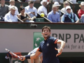 Austria's Dominic Thiem returns the ball to Italy's Marco Cecchinato during their semifinal match of the French Open tennis tournament at the Roland Garros stadium, Friday, June 8, 2018 in Paris.