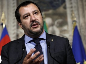 FILE - In this Monday, May 14, 2018 file photo, Leader of the League party, Matteo Salvini, addresses the media after meeting with Italian President Sergio Mattarella, at the Quirinale presidential palace, in Rome. The first group of migrants to arrive in Italy since a populist government took office is at the center of a spat between Italy's new interior minister and fellow EU member Malta. Some 230 African migrants landed in Calabria on Saturday after receiving authorization from the Interior Ministry. But before their ship docked, Interior Minister Matteo Salvini lashed out at Malta for allegedly denying the vessel permission to port.