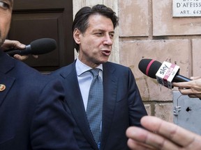 Italy's premier-designate Giuseppe Conte leaves his house in Rome, Friday, June 1, 2018. Italy's president has tapped politically inexperienced law professor Giuseppe Conte to be the premier who will head Italy's first populist government. The president's office announced Thursday that Conte had accepted the role and would be sworn in Friday afternoon with Cabinet ministers.