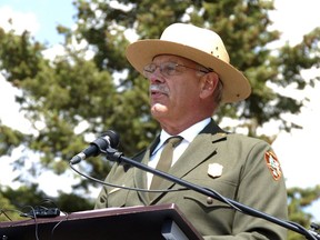 FILE - In this Aug. 17, 2017 file photo, Yellowstone Superintendent Dan Wenk speaks at an event marking a conservation agreement for a former mining site just north of the park in Jardine, Mont. Democrats are asking U.S. Interior Secretary Ryan Zinke to explain the reassignment of dozens of senior agency officials including Wenk.