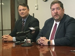 Special Agent Rick Rahn, left, of the Iowa Division of Criminal Investigation and Muscatine County Attorney Alan Ostergren appear at a news conference in Muscatine, Iowa, on Friday, June 1, 2018. Rahn and Ostergren announced the arrest of Annette Cahill in the 1992 beating death of Corey Lee Wieneke, saying a key witness had recently come forward with new information.