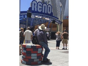 Visitors to the BBQ, Brews and Blues festival listen to a band in downtown Reno on June 16, 2018. The number of tourists visiting Reno-Sparks and Washoe County over the past year topped the 5 million mark for the first time since 2007.