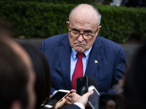 Rudy Giuliani speaks to reporters at the White House on Thursday.