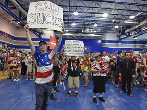 Protesters gather in front of the media before President Trump who is in town to support Gov. Henry McMaster speaks to the crowd at Airport High School Monday, June 25, 2018, in West Columbia, S.C.