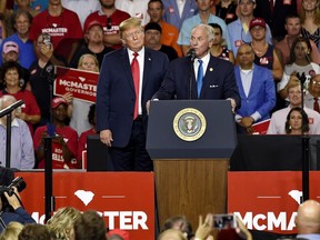 South Carolina Gov. Henry McMaster, with President Donald Trump by his side, speaks to the crowd at Airport High School, Monday, June 25, 2018, in West Columbia, S.C.