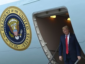 President Donald Trump walks down the steps of Air Force One at Columbia Metropolitan Airport in West Columbia, S.C., Monday, June 25, 2018. Trump is campaigning for Republican Gov. Henry McMaster, returning the favor after McMaster provided Trump with an early endorsement in his presidential campaign.
