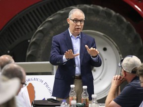 Environmental Protection Agency Administrator Scott Pruitt addresses farmers during a forum at a farm near Reliance, S.D. Farmers and ethanol producers gave Pruitt a rough reception in South Dakota, accusing him of undermining the industry that's a key part of the state's economy.