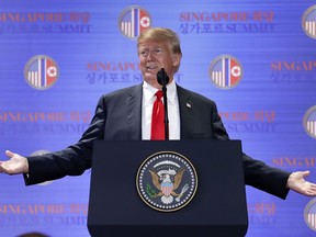 U.S. President Donald Trump answers questions about the summit with North Korea leader Kim Jong Un during a press conference at the Capella resort on Sentosa Island Tuesday, June 12, 2018 in Singapore.