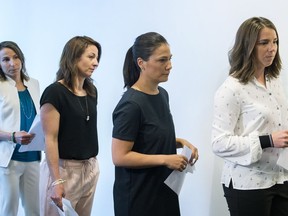 Victims of Bertrand Charest, from left, Amelie-Frederique Gagnon, Gail Kelly, Anna Prchal and Genevieve Simard arrive for a news conference in Montreal on June 4.