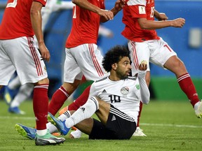 Egypt's Mohamed Salah gestures after he was fouled during the group A match between Russia and Egypt at the 2018 soccer World Cup in the St. Petersburg stadium in St. Petersburg, Russia, Tuesday, June 19, 2018.