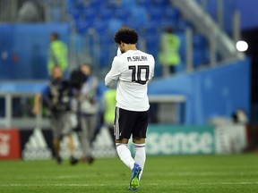 Egypt's Mohamed Salah leaves the pitch after the group A match between Russia and Egypt at the 2018 soccer World Cup in the St. Petersburg stadium in St. Petersburg, Russia, Tuesday, June 19, 2018.