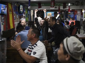 Fans celebrate the final whistle as Russia beat Egypt in the World Cup at the Pelikan Sports Bar in Ulan-Ude, a city in Russia’s far east, in the early morning hours of June 20.