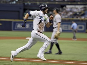 Tampa Bay Rays' Kevin Kiermaier races home to score on an RBI double by Jake Bauers off New York Yankees starting pitcher Sonny Gray during the first inning of a baseball game Saturday, June 23, 2018, in St. Petersburg, Fla.