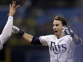 Tampa Bay Rays' Matt Duffy celebrates his game-winning RBI single off Toronto Blue Jays relief pitcher Ryan Tepera in the ninth inning of a baseball game Wednesday, June 13, 2018, in St. Petersburg, Fla. The Rays won the game 1-0.