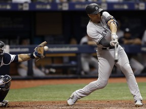 New York Yankees' Giancarlo Stanton strikes out against Tampa Bay Rays pitcher Ryne Stanek during the sixth inning of a baseball game Saturday, June 23, 2018, in St. Petersburg, Fla.
