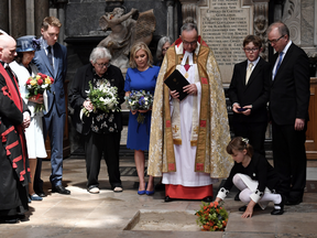 Dean of Westminster, John Hall, accompanied by members of Stephen Hawking's family, presides over the internment of the ashes of the late British scientist in the nave of Westminster Abbey on June 15, 2018 in London, England.