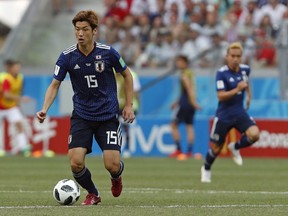 Japan's Yuya Osako controls the ball during the group H match between Japan and Poland at the 2018 soccer World Cup at the Volgograd Arena in Volgograd, Russia, Thursday, June 28, 2018.