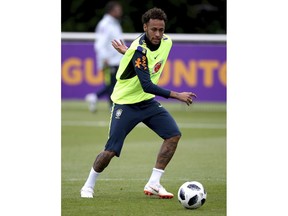 Brazil's Neymar controls the ball during a training session at Enfield Training Ground, London Thursday June 7, 2018 as they prepare for the upcoming soccer World Cup.