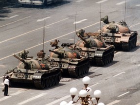 A man stands alone to try to block a line of tanks in Beijing's Tiananmen Square in an iconic photograph from June 5, 1989.