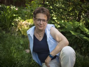 Lisa Freedman, who is now cancer-free, poses for a photo outside her Toronto home on Friday, June 8, 2018.