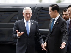 U.S. Defense Secretary Jim Mattis, left, is greeted by his South Korean counterpart Song Young-moo upon his arrival at the Defense Ministry in Seoul, South Korea, Thursday, June 28, 2018.