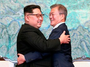 FILE - In this April 27, 2018 file photo, North Korean leader Kim Jong Un, left, and South Korean President Moon Jae-in embrace each other after signing on a joint statement at the border village of Panmunjom in the Demilitarized Zone, South Korea. After six years of self-imposed isolation from the world stage, North Korean leader Kim Jong Un has demonstrated a surprisingly well stocked toolbox of negotiating tactics in high-stakes summits with the presidents of South Korea and China over the past two months. (Korea Summit Press Pool via AP, File)