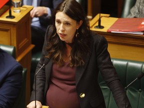 FILE - In this May 22, 2018, file photo, New Zealand's Prime Minister Jacinda Ardern addresses Parliament in Wellington, New Zealand. Ardern arrived Thursday, June 21, 2018 at the country's largest public hospital as she prepared to give birth to her first child. Her pregnancy has been followed around the world, with many hoping the 37-year-old will become a role model for combining motherhood with political leadership.