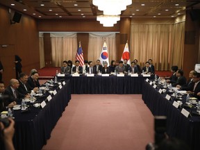 U.S. Secretary of State Mike Pompeo, third from left, South Korean Foreign Minister Kang Kyung-wha, center, and Japanese Foreign Minister Taro Kono, second from right, attend their meeting at Foreign Ministry in Seoul, South Korea, Thursday, June14, 2018.