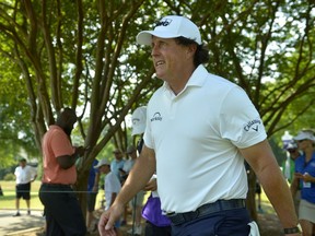 Phil Mickelson walks between holes during the second round of the St. Jude Classic golf tournament at TPC Southwind, Friday, June 8, 2018, in Memphis, Tenn.